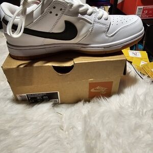 Nike White Sneakers with Black Swoosh